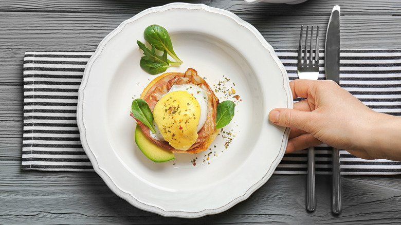 Classic eggs benedict with table settings