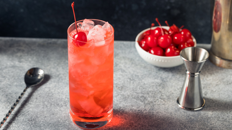 Shirley temple in glass with cherry garnish