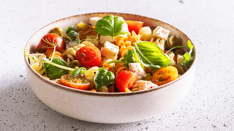 Pasta salad with veggies marinated in vinaigrette