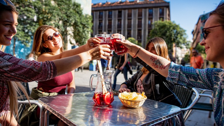 Group of friends drinking vermouth in Spain