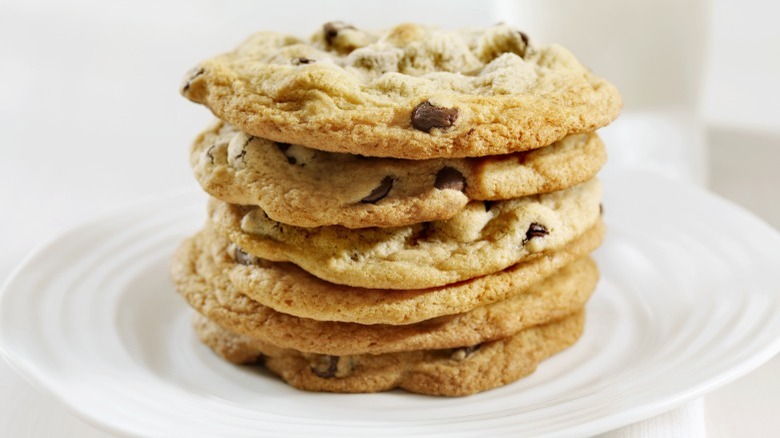 Thin chocolate chip cookies stacked 
