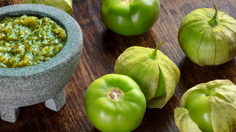 Tomatillos with husks and salsa verde