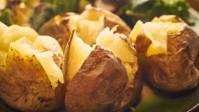 Jacket potatoes with salad background