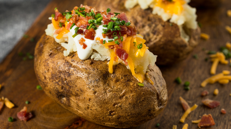 Baked potato with bacon, sour cream, and cheddar