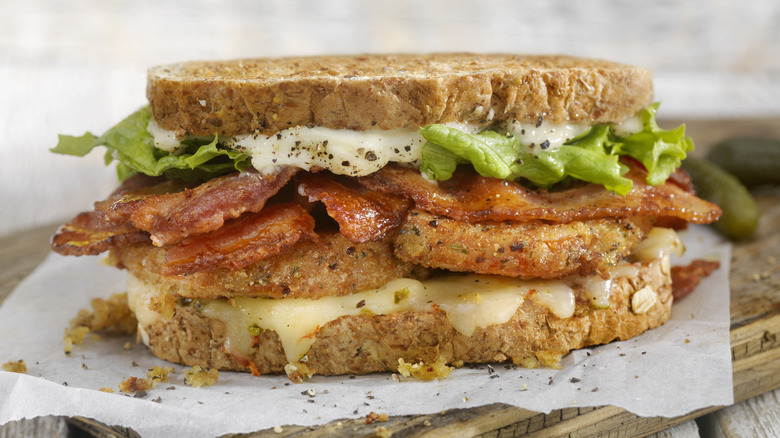 Fried green tomato sandwich with bacon and cheese
