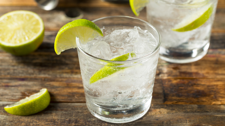 Vodka tonic cocktail with lime wedge