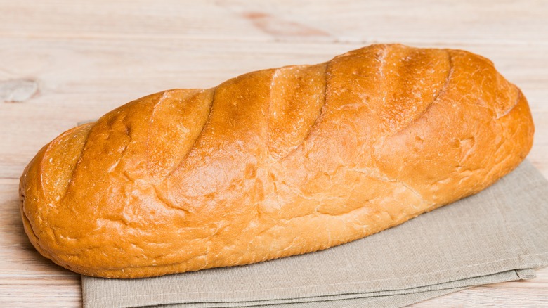 A loaf of baked American French bread on a napkin