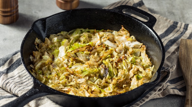Cabbage sauteing in a pan