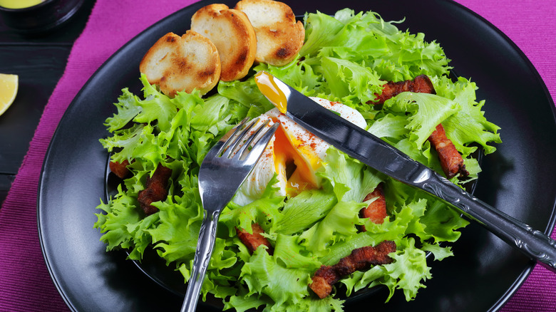 Lyonnaise salad with knife and fork