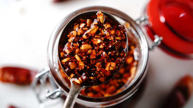 spoonful of chile crisp from glass jar