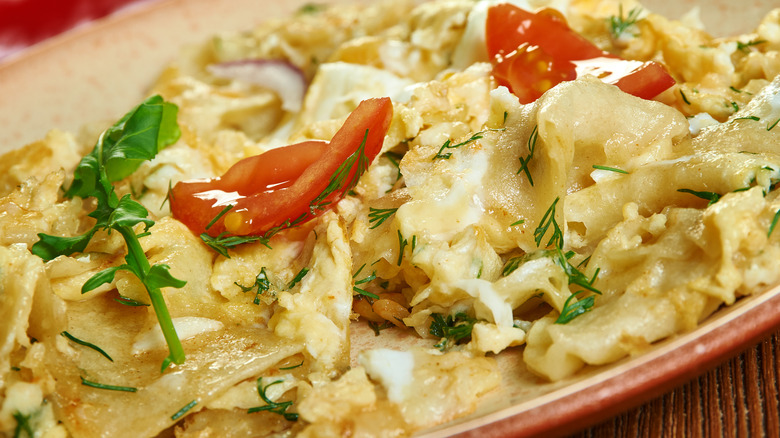 Matzo brei in red serving dish