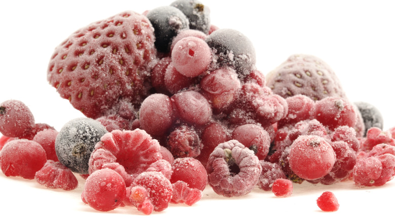 frozen berries on white background