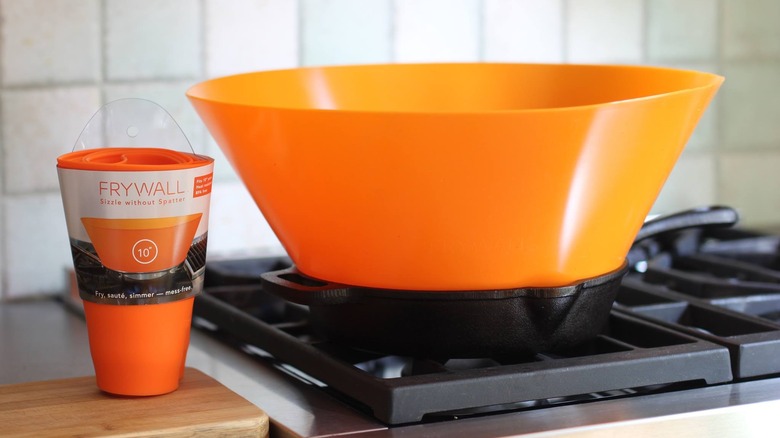 Orange frywall in pan on stove