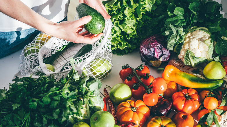 Person unpacking fresh vegetables