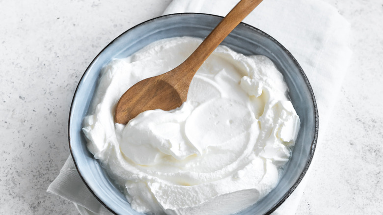 Greek yogurt in a bowl with spoon