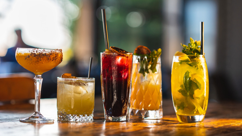 array of cocktails on bar