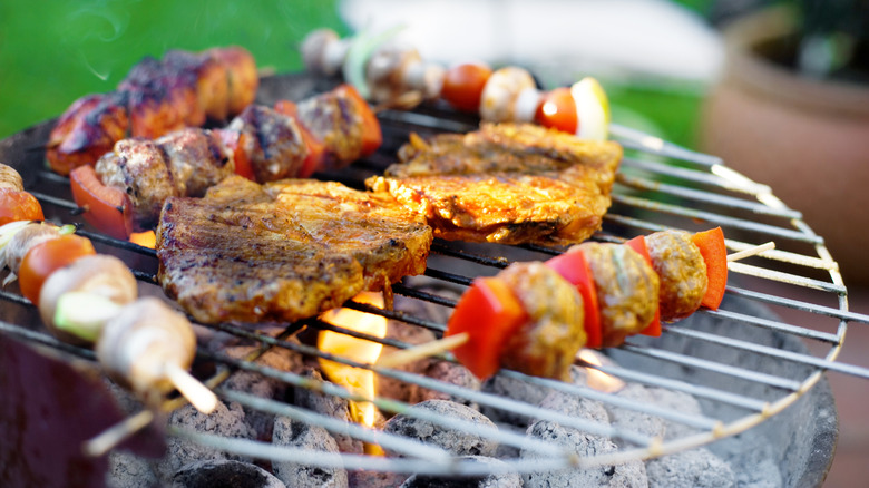 Variety of foods on charcoal grill