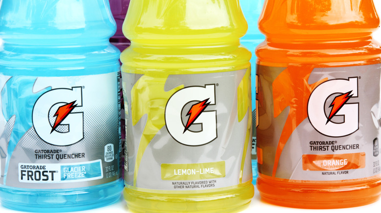 Three bottles of Gatorade sitting in a row.