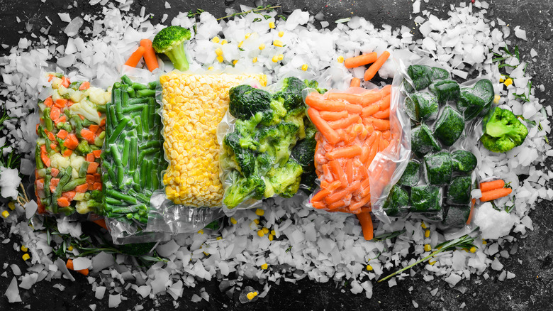 assortment of frozen vegetables on ice