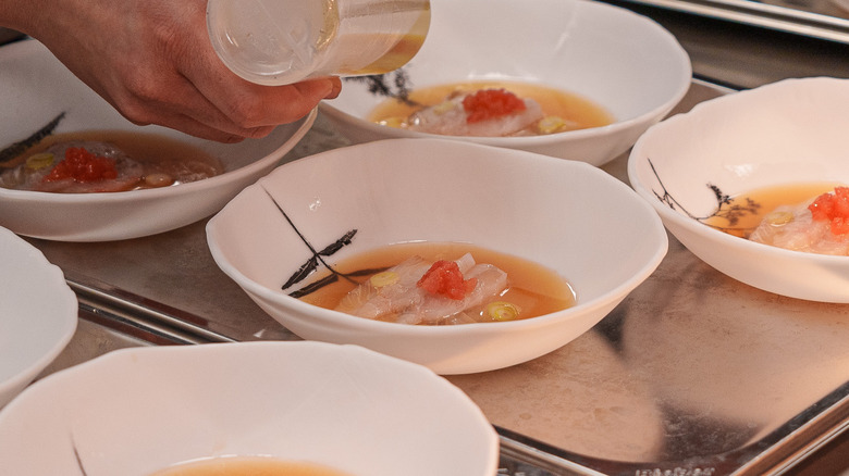 sashimi dish being prepared