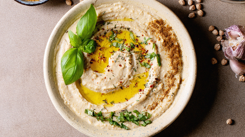 bowl of hummus with spices in bowls