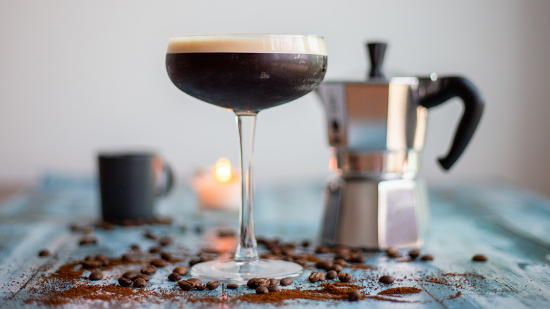 Espresso martini with espresso pot in background