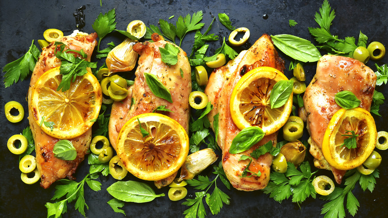 Chicken breasts with roasted lemons, parsley, and green olives