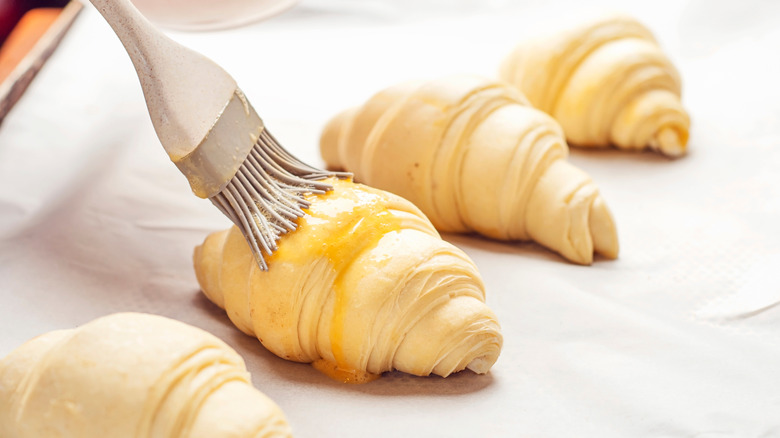 Brushing pastries with glaze