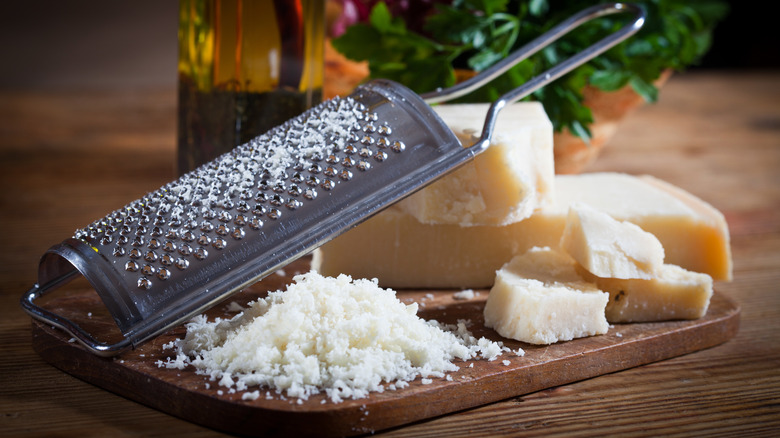 grated and solid parmesan next to grater