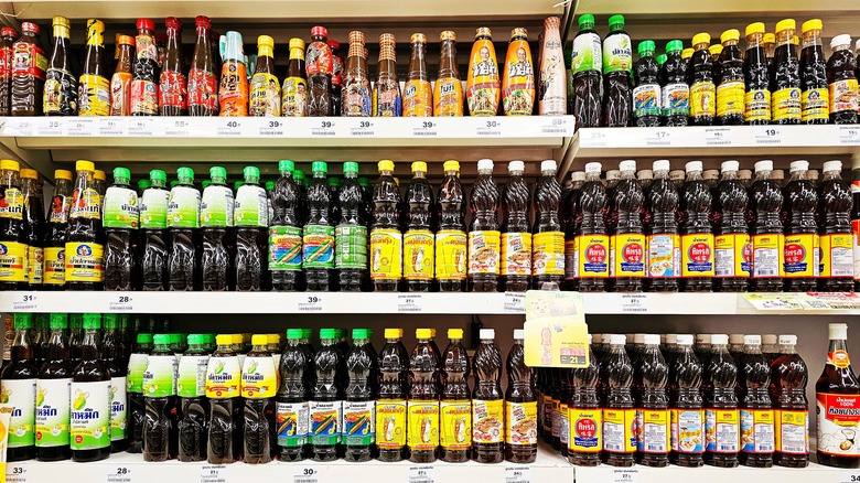 a grocery store display of fish sauce