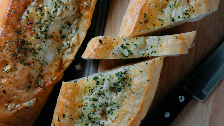 Close up of garlic bread on a cutting board