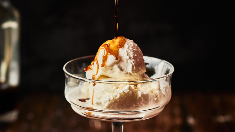 Glass of ice cream with liquor poured on top