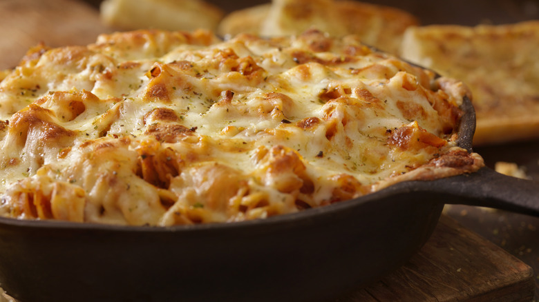 Baked pasta with cheese in pan