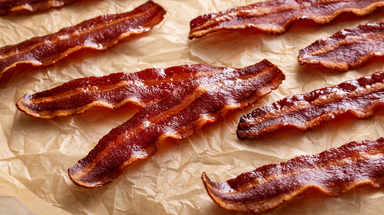 cooked turkey bacon on parchment lined sheet