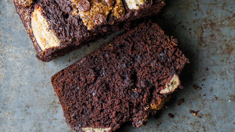 double chocolate banana bread slice on a stone background