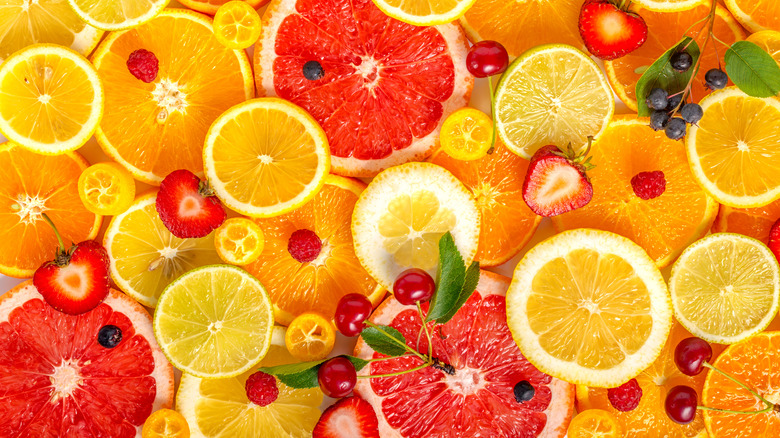 Assortment of sliced citrus and berries
