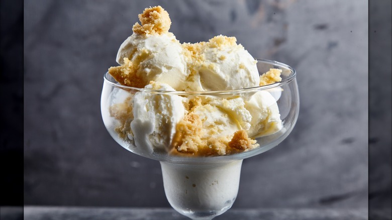 Vanilla ice cream sundae with crumbled cookie topping