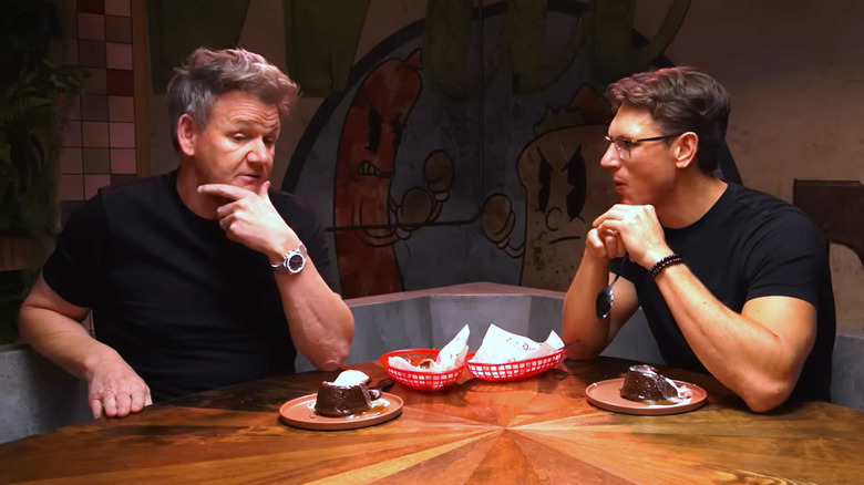 Chef Gordon Ramsay eats sticky toffee pudding at a table with "Last Meals" host Josh Scherer