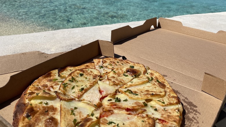 Traditional Gozo ftira in box with potato and cheese