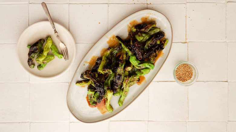 Plate of grilled shishito peppers