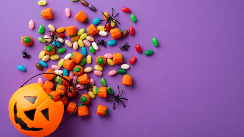 Halloween bucket spilling with candy pieces