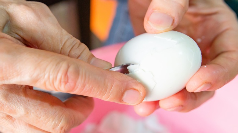 egg being peeled