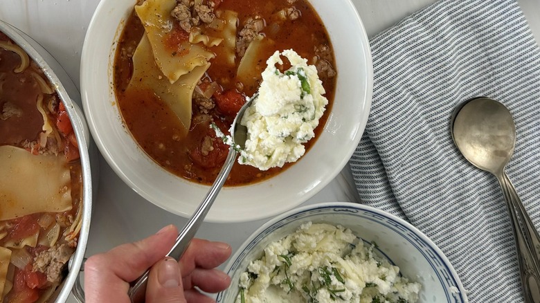 cheese spread hovering over soup