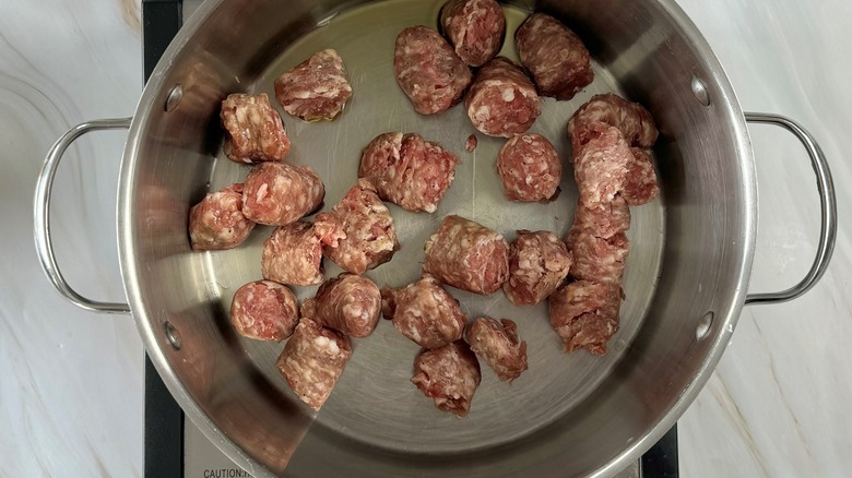 sausage chunks in metal pot