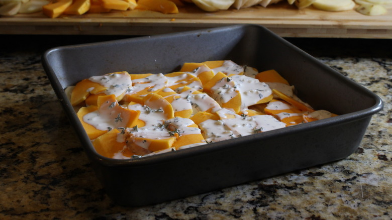 baking dish with pumkin slices and cream