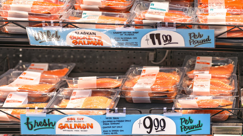 signs for wild-caught and farm-raised salmon