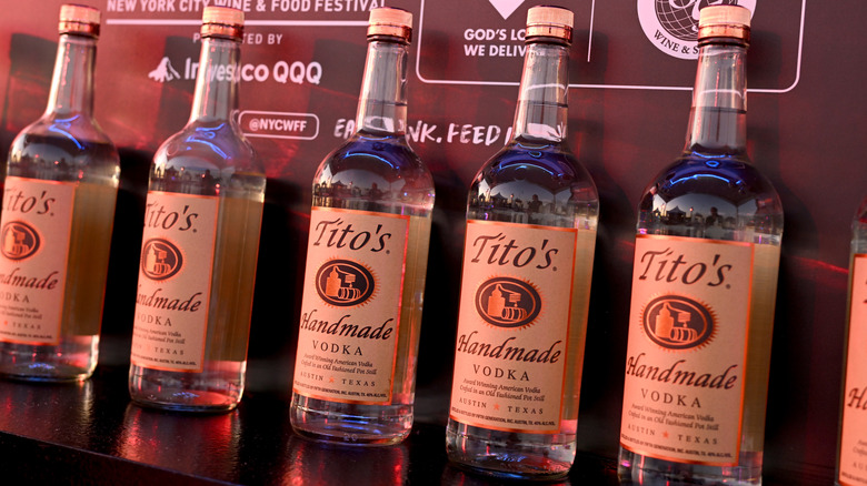 bottles of Tito's Vodka in a row