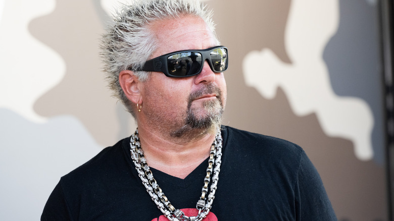 Guy Fieri posing in sunglasses