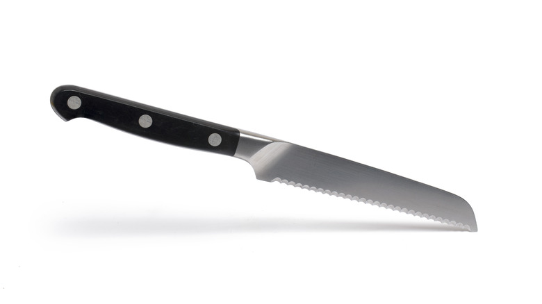 Serrated knife white background