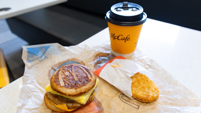 A McGriddle breakfast sandwich, hash brown and McCafe coffee